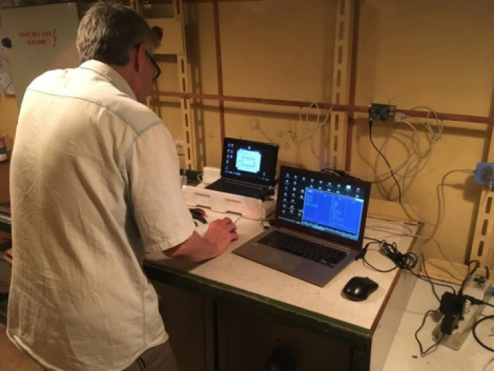 Fig. 12. Magnetometric laboratory with the MVC-2 stationary recording magnetometers complex on the oceanographic research vessel “Admiral Vladimirsky”. IZMIRAN Employee, Soldatov V.A., is monitoring the equipment operation and taking measurements on exper