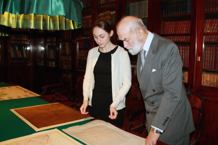 Prince Michael of Kent gets acquainted with maps from the collection of the Russian Geographical Society.  Photo: Tatyana Nikolaeva