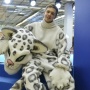 The volunteer of the Russian Geographical Society Kirill Lukyanov in a growth figure of a snow leopard at the Festival of the Russian Geographical Society. Photo by the press-service of the Russian Geographical Society